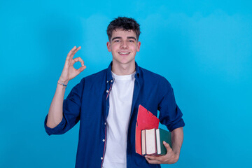 Wall Mural - teen student with books isolated on background with copy-space