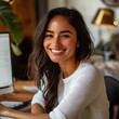 © Настя Шевчук - Young hispanic female smiling at desk in cozy office environment
