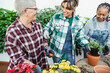 © DisobeyArt - Multiracial women preparing flowers plants at home garden shop outdoor - Spring time and gardening concept - Main focus on left woman face