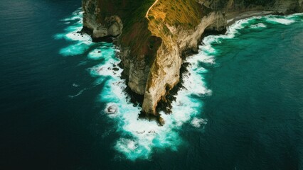 Sticker - Aerial view of dramatic coastal cliffs with rich green vegetation surrounded by deep turquoise waters and contrasting white foam waves below.