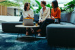 © Jacob Lund - Professional women discussing tax strategies during a casual meeting