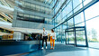 © Jacob Lund - Modern office lobby with colleagues walking together