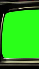 Wall Mural - vintage crt television turning on and off with green screen and static - vertical 4k