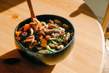 Wall Mural - coconut bowl with salad on a table