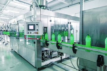 Poster - bottle filling machine operates in a clean beverage production facility during daylight hours