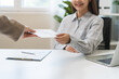 © KMPZZZ - Good job, asian manager business giving financial reward in an envelope, business letter extra salary to company employee, woman worker office hand received premium bonus, getting cheque from her boss