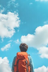 Wall Mural - Hiker looking up at sky