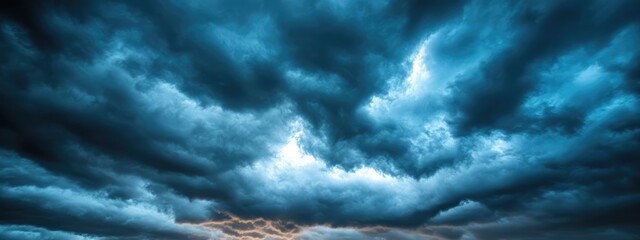 Poster - Dramatic dark sky with intricate cloud formations and ample empty space for text or graphic overlay in a striking visual composition