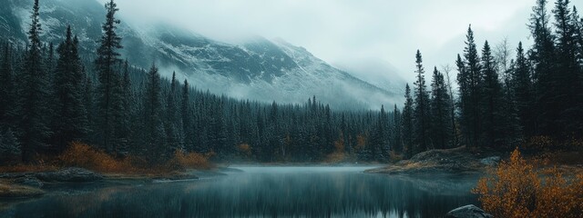 Poster - Dramatic mountain landscape with misty forest surrounding tranquil lake and ample space for text or graphics