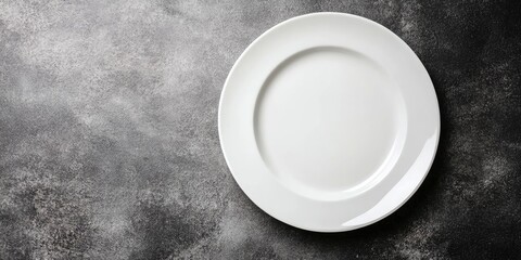 Aufkleber - Minimalist white plate on textured gray background with empty space ideal for showcasing gourmet dishes or fine dining concepts.
