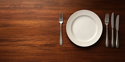 Fototapete - Elegant dining table settings with silverware and an empty plate on a wooden surface for menu or text placement.