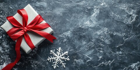 Aufkleber - Elegant Silver Gift Box with Red Ribbon and Snowflake on Dark Textured Background for Holiday Themed Promotions and Seasonal Messages