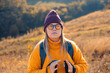 © Zoran Zeremski - Portrait of woman hiking at top of the hill at meadow.