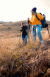 © Zoran Zeremski - Two smiling woman hiking at top of the hill at meadow.