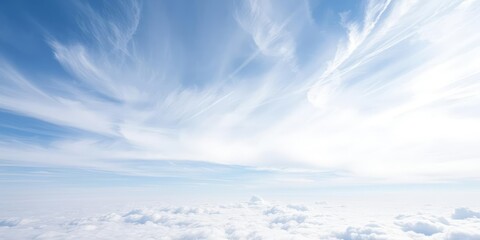 Wall Mural - Cirrus clouds in a wispy formation on blue sky background, climate, atmospheric, ethereal