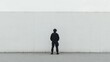 © musa - Lone guard facing tall white wall.