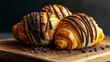 © Thanate - Delicious Chocolate Croissants on Wooden Board