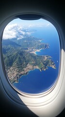 Wall Mural - Aerial view of coastal mountains and ocean from airplane window.