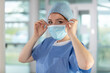 © auremar - young woman doctor in cap and face mask