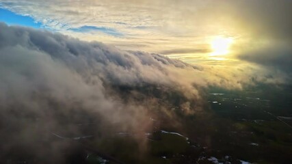 Wall Mural - dramatic cloudscape over landscape, sunset, sunrise, view from surface of the clouds, beautiful sun,