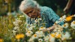© Erik - An old woman collects medicinal herbs. Selective focus.