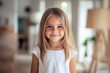 © id512 - smiling young 6 year old girl in white dress standing at home