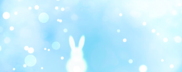 Wall Mural - easter bunny with blurred bokeh lights - spring background panorama greeting card - season decoratio