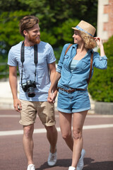 happy couple of tourists taking in old city