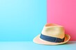 © Guy - Stylish Straw Fedora Hat on Pastel Pink and Blue Background Summer Fashion Accessory