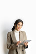 © Stock 4 You - Vertical isolated portrait of young latin hispanic professional business woman working on tab pc computer. Middle eastern businesswoman holding digital tablet using pad application on white background