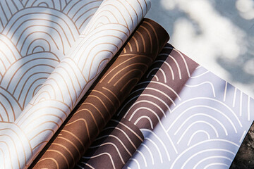Poster - Rolled patterned papers in various earth tones.