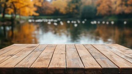 Aufkleber - Empty wooden table by lake with ducks swimming in autumn