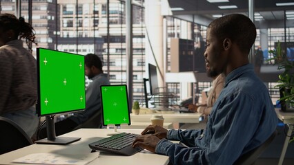 Poster - black businessman analyzing financial data next to chroma key screen, reviewing company strategies o