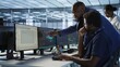 © DC Studio - Data center manager helps intern implement AI predictive maintenance systems. Server farm supervisor checks work done by employee using artificial intelligence to identify hardware failures, camera A