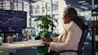 © DC Studio - African american CEO sharing sales insight on videocall with forecast affiliates, discussing about profit and analytics in a high end office. Entrepreneur looking to expand her enterprise. Camera B.