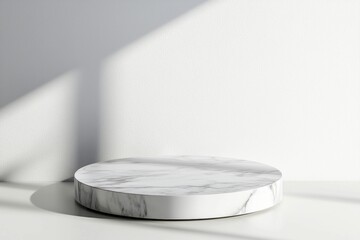 Poster - Empty marble podium resting on a white background, illuminated by natural window light casting soft shadows, creating an ideal setting for minimalist product displays and elegant presentations