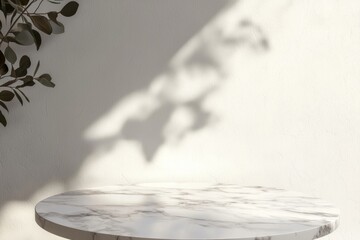Poster - Empty round marble table basking in sunlight, casting plant shadows on a textured white wall, creating an elegant backdrop ideal for showcasing products or objects