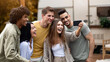 © Prostock-studio - Positive multiracial friends taking selfie near their trailer, smiling and having fun together during autumn camping trip. Cheerful young people making photo of themselves at campsite