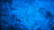 © Наталья Босяк - Black cobalt blue concrete wall surface. Grunge texture background. Close-up. Paint. Crack old rough broken damaged crumbled. Dark light. Building facade exterior.