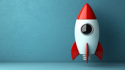 Poster - Red and white rocket against blue wall.