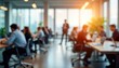 © Pete - Blurred modern office interior shows group of businesspeople working in collaborative workspace. People sit around tables working on laptops. Business meeting conference in progress. Dynamic