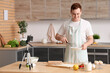 © Pixel-Shot - Male chef with dough and fruits recording cooking video in kitchen