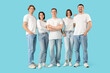 © Pixel-Shot - Group of young people in jeans on blue background