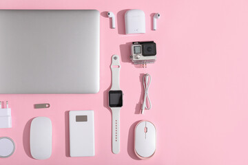 Wall Mural - set of modern devices on pink background, top view