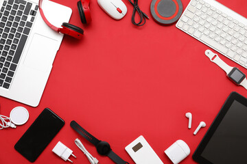 Wall Mural - frame made of modern devices on red background