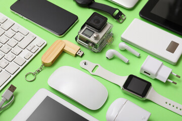 Wall Mural - many modern devices on green background