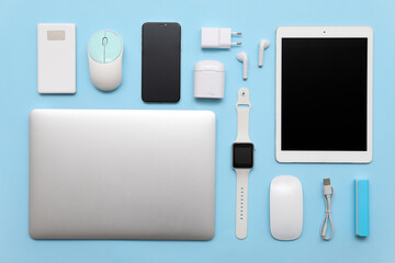 Wall Mural - set of modern devices on blue background, top view