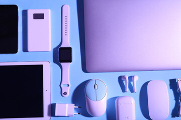 Wall Mural - set of modern devices on blue background, top view
