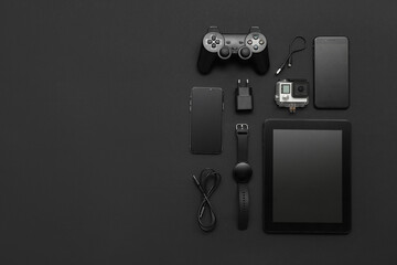 Wall Mural - set of modern devices on black background, top view