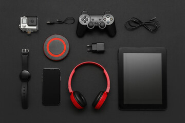 Wall Mural - set of modern devices on black background, top view